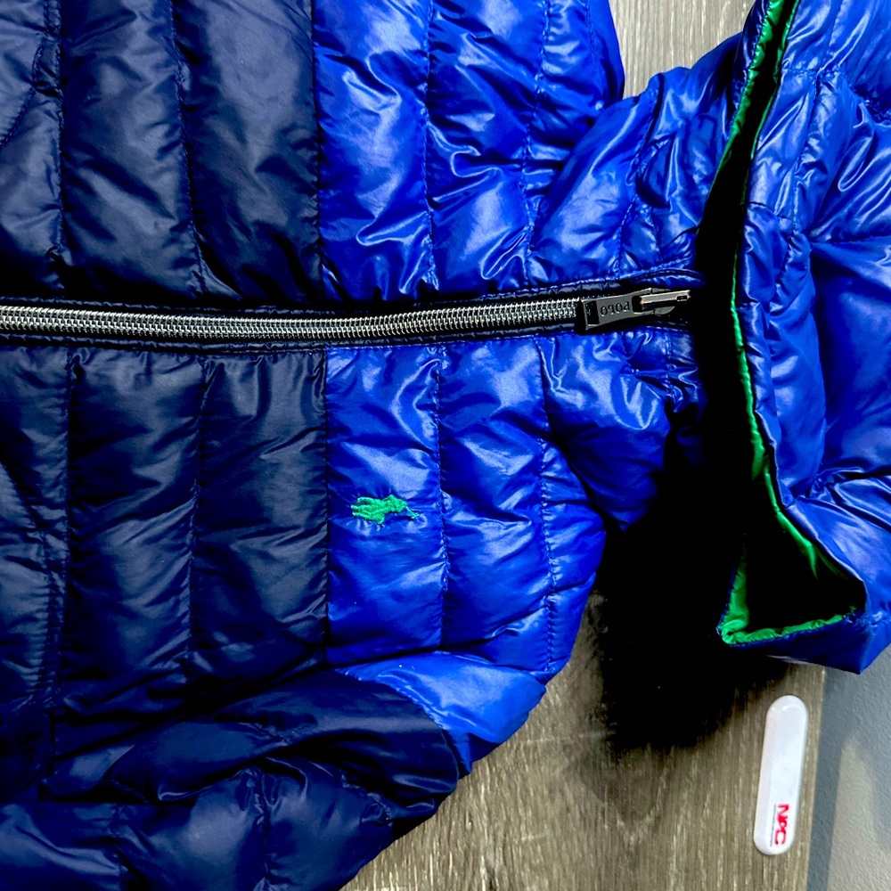 Polo reversible coat size 2t on the navy blue side there’s a tiny hole
